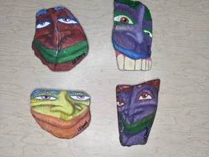 lot 149 image: A Set of Four Rock Paintings with Faces N