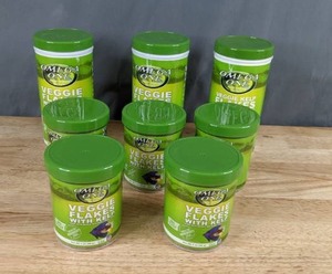 lot 73 image: Set of 8 Omega One Veggie Flakes w Kelp of Various Sizes X