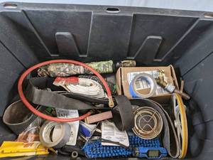 lot 317 image: Large Bin of Garage Goodies Duck Tape, Coax Cable, Caster Wheels, Hinges, and More Z