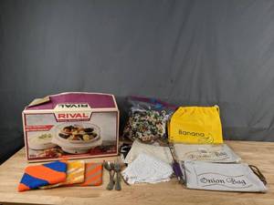 lot 201 image: Assortment of Kitchen Accessories Rival Automatic SteamerRice Cooker, Potato Bag, Banana Bag, Onion Bag, Doilies and More Q