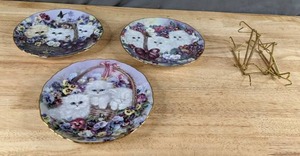 lot 164 image: Collection of Decorative Kitten Plates by Lily Chang Basket of Love, Bundle of Joy, & Hearts of Gold Q