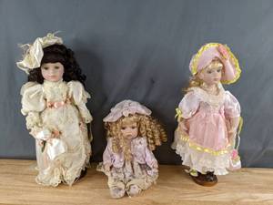 lot 339 image: Collectible Dolls Very Frilly Young Ladies, Two on Stands and One Seated Q