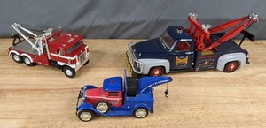 lot 252 image: Group of 3 Toy Tow Trucks CarQuest, Ford Road Legends Towing & Other Q