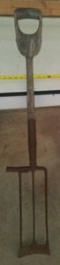 Antique wood and metal shovel
