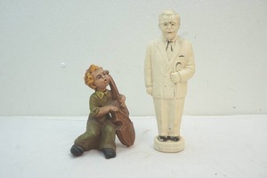 lot 24 image: plastic Col. Sanders and ceramic boy statue