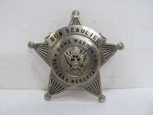 lot 268 image: Original Vintage Red Lake Reservation Game Warden Badge