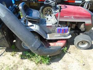 lot 131 image: Ward 1442 riding lawn mower with dual bagger. 14 hp Briggs engine. 42 deck. 7 speed. Smokes on start up then clears up. As shown.
