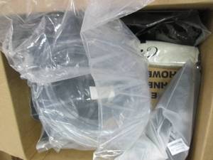 box of shower caddy, small back pac...