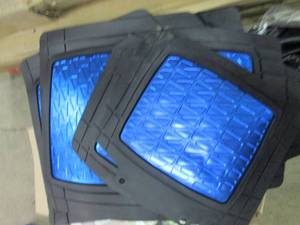 box of auto floor mats, seat covers...