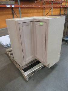 lot 255 image: Hampton Assembled 28.5x34.5x16.5 in. Lazy Susan Corner Base Kitchen Cabinet in Unfinished Beech. Slight Crack back corner (See Photos).