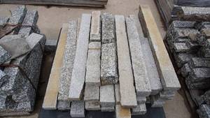 lot 2 image: Pallet of granite slabs, sizes varying with the longest measuring 38 inches  Includes pallet Skid-loader on site