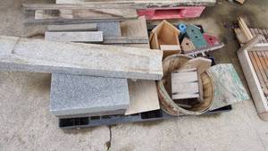 lot 8 image: Mixed pallet including three granite slabs with the largest measuring 28 inches x 4 inches x 16 inches deep, wood bird houses, bushel basket etc.