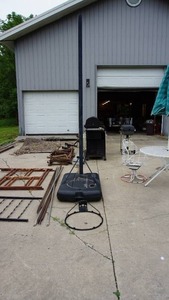 lot 19 image: Steel basketball post with fillable plastic base, hoop, no net