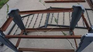 lot 20 image: Steel cart base on casters 40 x 20 x 27, no top, cast iron stair railing