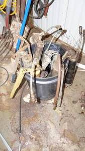 lot 32 image: Bucket of grease guns