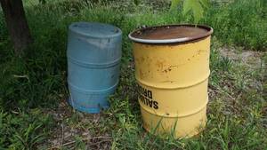 lot 47 image: Two salvagecompost drums with the biggest measuring 39 inches tall with a 27 inch diameter