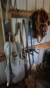 lot 46 image: Miscellaneous garage items Including pitchfork shovel room jumper cables welding shield etc.