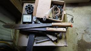 lot 73 image: Miscellaneous vintage tool lot including multiple hatchets with one being a a CORONa 28 inch hatchet, two metal squares two collapsible tape measures etc.