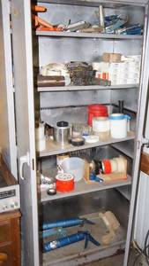 lot 74 image: Industrial metal storage cabinet 3 ft x 1 12 ft x 6 ft tall, includes contents of cabinettape, staple gun, staples grease guns, caulking guns etc.