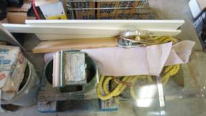 lot 86 image: Pallet of miscellaneous garage items including Vintage Motorcycle windshield, Sisal rope, heavy duty army green canvas totecover, mop bucket with rollers, suede fabric roll etc.
