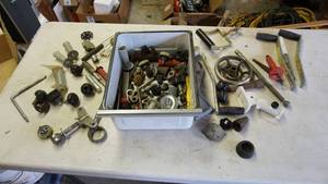 lot 96 image: Bin of vintage faucets, knobs and pulls etc. please see all photos for best description