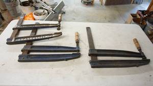 lot 102 image: Vintage steel viceclamp set of three Looks to be used when inserted into a steel workbench