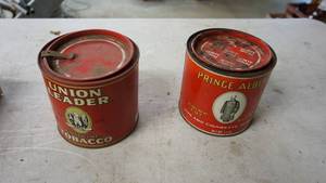 lot 122 image: Two 5-inch round Union Leader tobacco tins with lids