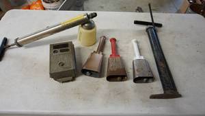 lot 124 image: Vintage lot with three custom-made bells, foot pump, pump sprayer etc.