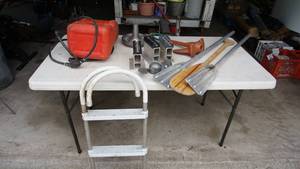 lot 127 image: Assorted lot of lakeboating items Including three-step hanging ladder, gas tank, propeller, clamps brackets etc.