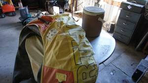 lot 155 image: Canvas covered inner-tube Big Bertha, COVEY tote coolerportable seat, round steel framed table