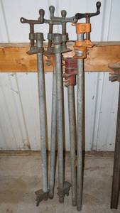 lot 176 image: Adjustable steel pole clamps with the longest at 38 inches