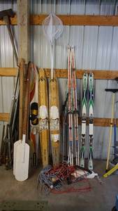 lot 180 image: Assorted outdoor recreation lot including water skis snow skis fishing net, tow ropes, canoe paddles etc.