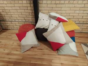 Collection Of Pillows And Bean Bag Stools