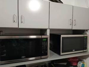 Two Oster Microwaves