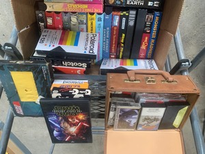 box of VHSs and Cassette tapes