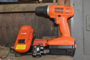 lot 102 image: black and decker drill with extra batteries and charger