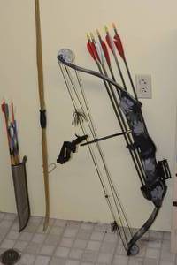 lot 134 image: thunder flite express bow with arrows, and recurve bow with arrows