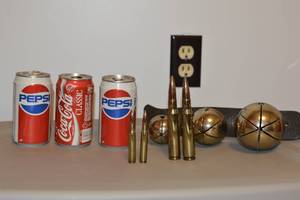 lot 203 image: old pepsi and coke cans bullets and bells
