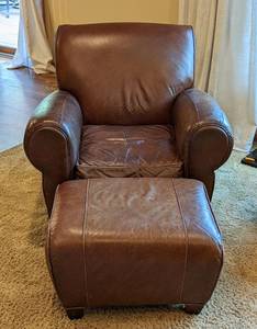 lot 2 image: Pottery Barn by Mitchell Gold Leather Armchair and Ottoman