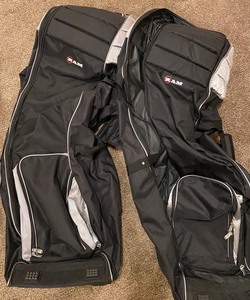 lot 157 image: Three Travel Golf Bags