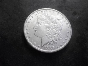 lot 11 image: 1885 O Morgan Silver Dollar