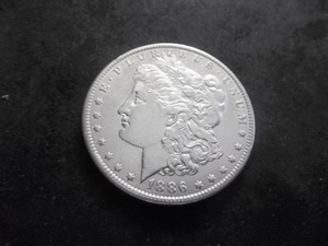 lot 14 image: 1886 O Morgan Silver Dollar