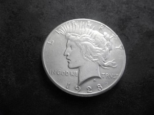 lot 56 image: 1928 Peace Silver Dollar