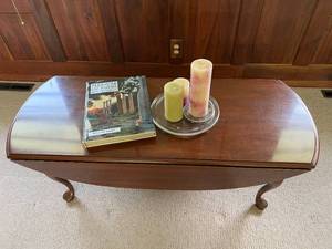 lot 9 image: Oval Wood Coffee Table, Book & Candles