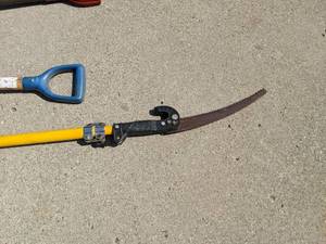 lot 84 image: 2 shovels and a pole saw...