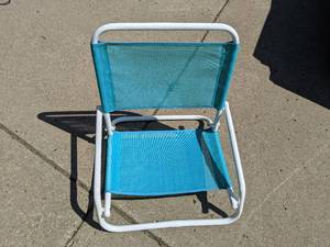 lot 92 image: Folding beach chair, perfect for si...