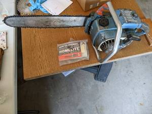 lot 97 image: Homelite XL-12 Chainsaw model # 211...