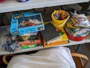 lot 121 image: 6 puzzles, several activity books, ...