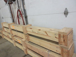 LONG, WOODEN CUSTOM MADE CRATES WITH INTERNATIONAL SHIPPING STAMPS