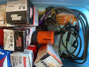 tote of oil filters  extension cord and misc plug wires mini bulbs